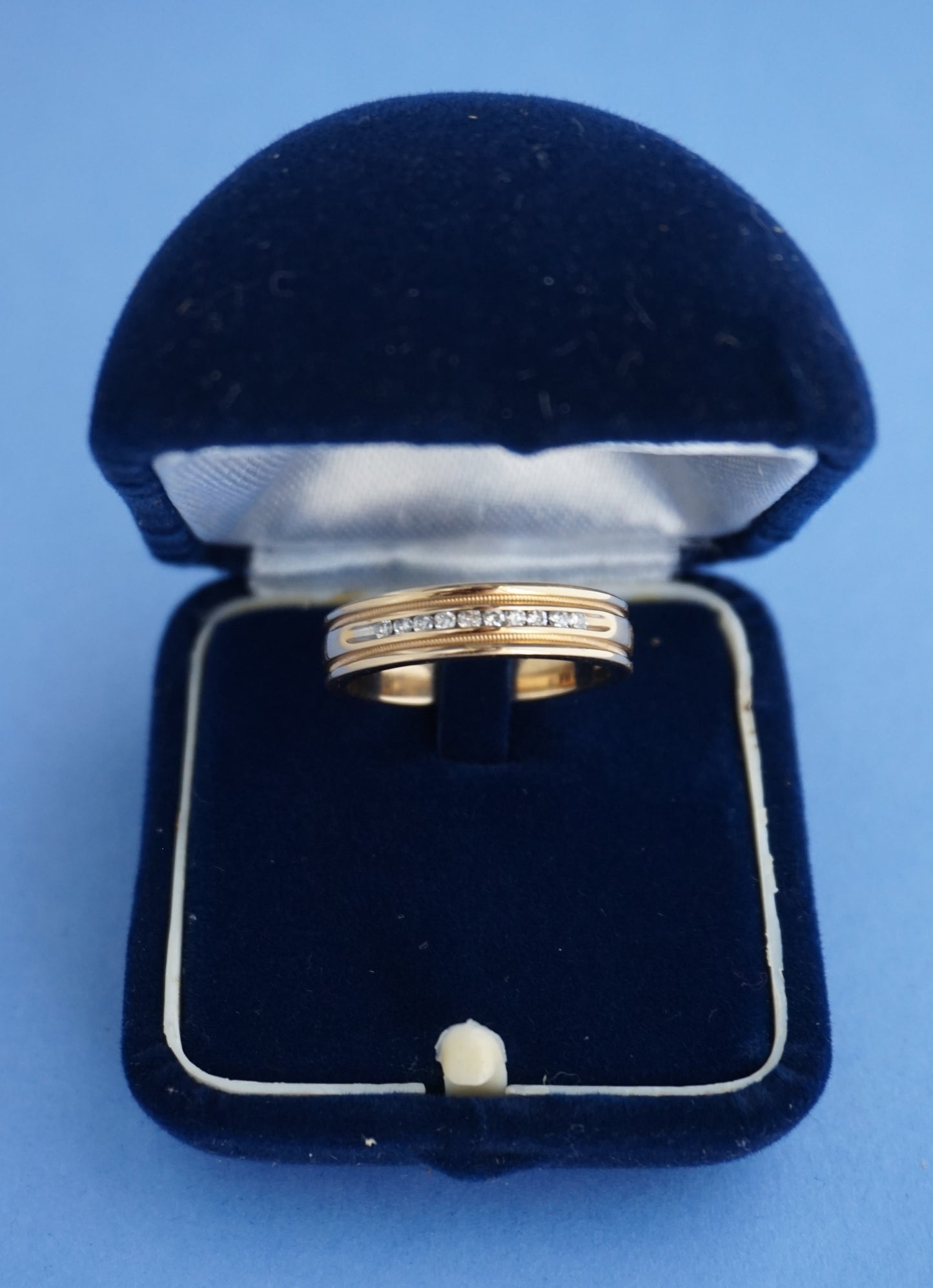 14k Gold band ring studded with channel set diamonds